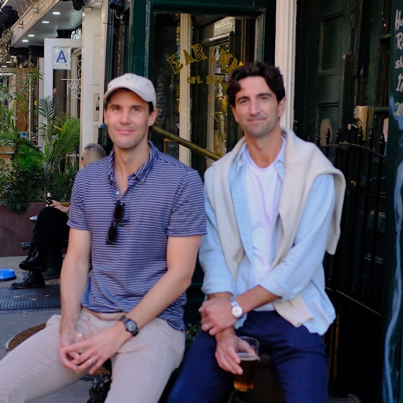 Founders posing for a picture in front of NY restaurant